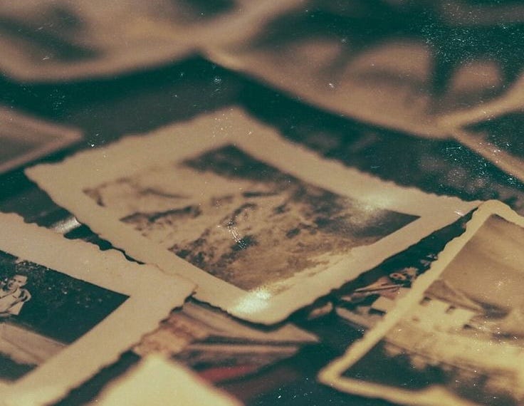 Old photographs scattered on a table